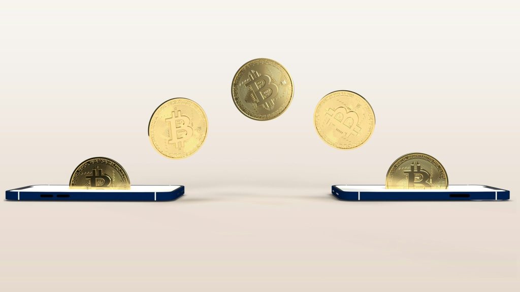 a bunch of coins flying out of a cell phone